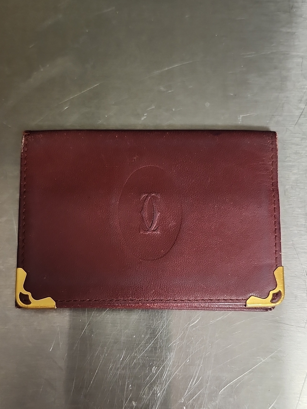 Cartier Burgundy Leather Card Case with Gold Logo